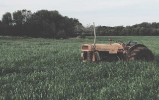 broken down tractor in a field