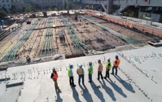 construction leaders looking over worksite