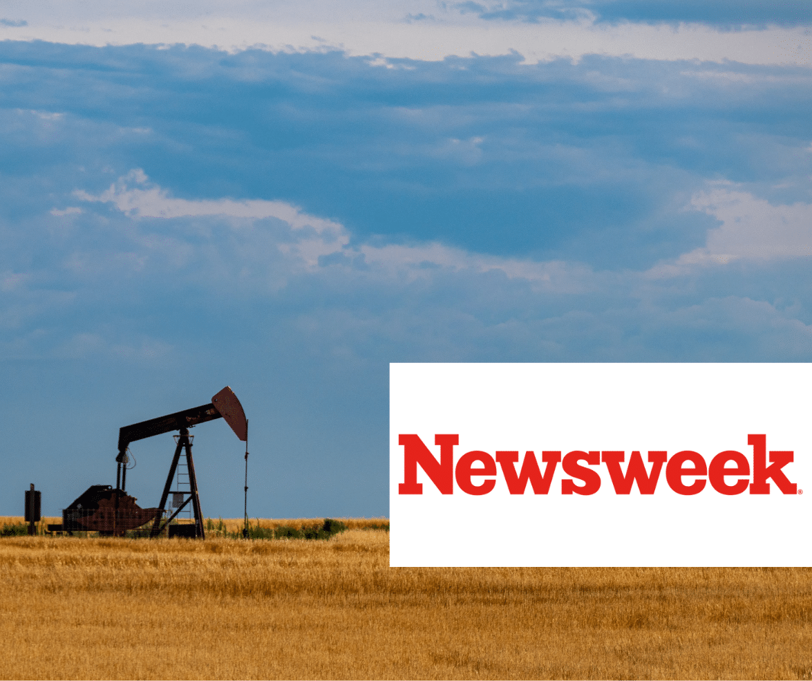 Single pumpjack in a field with the Newsweek logo in the foreground