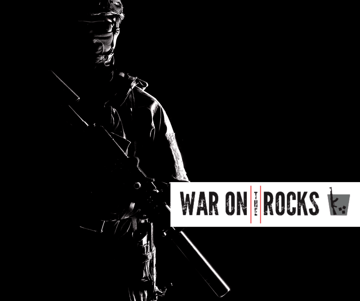 Silhouette of a soldier in darkness in the background with the War on the Rocks logo in the foreground