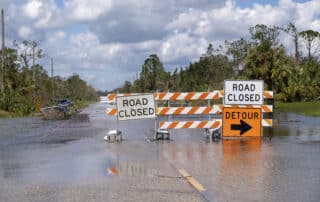 Flooded road with Road Closed signs